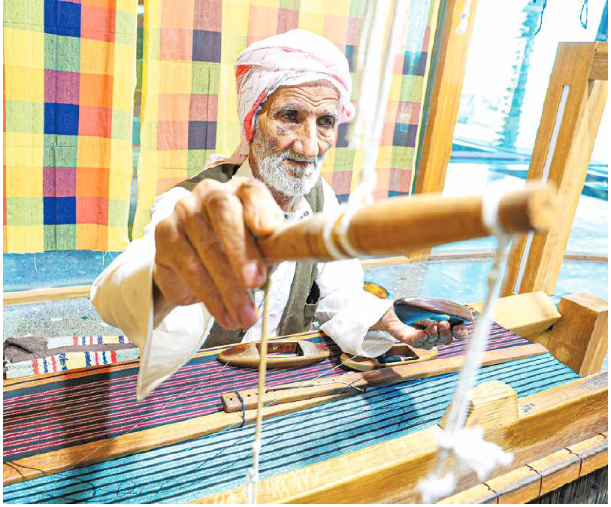Weaving cotton in the Bani Jamra weaving factory